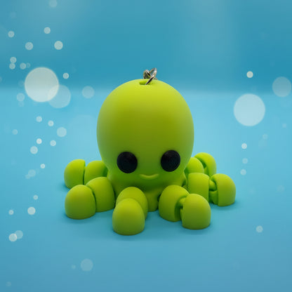 Green baby octopus on a blue background