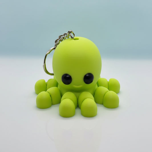 Green baby octopus keychain with white background